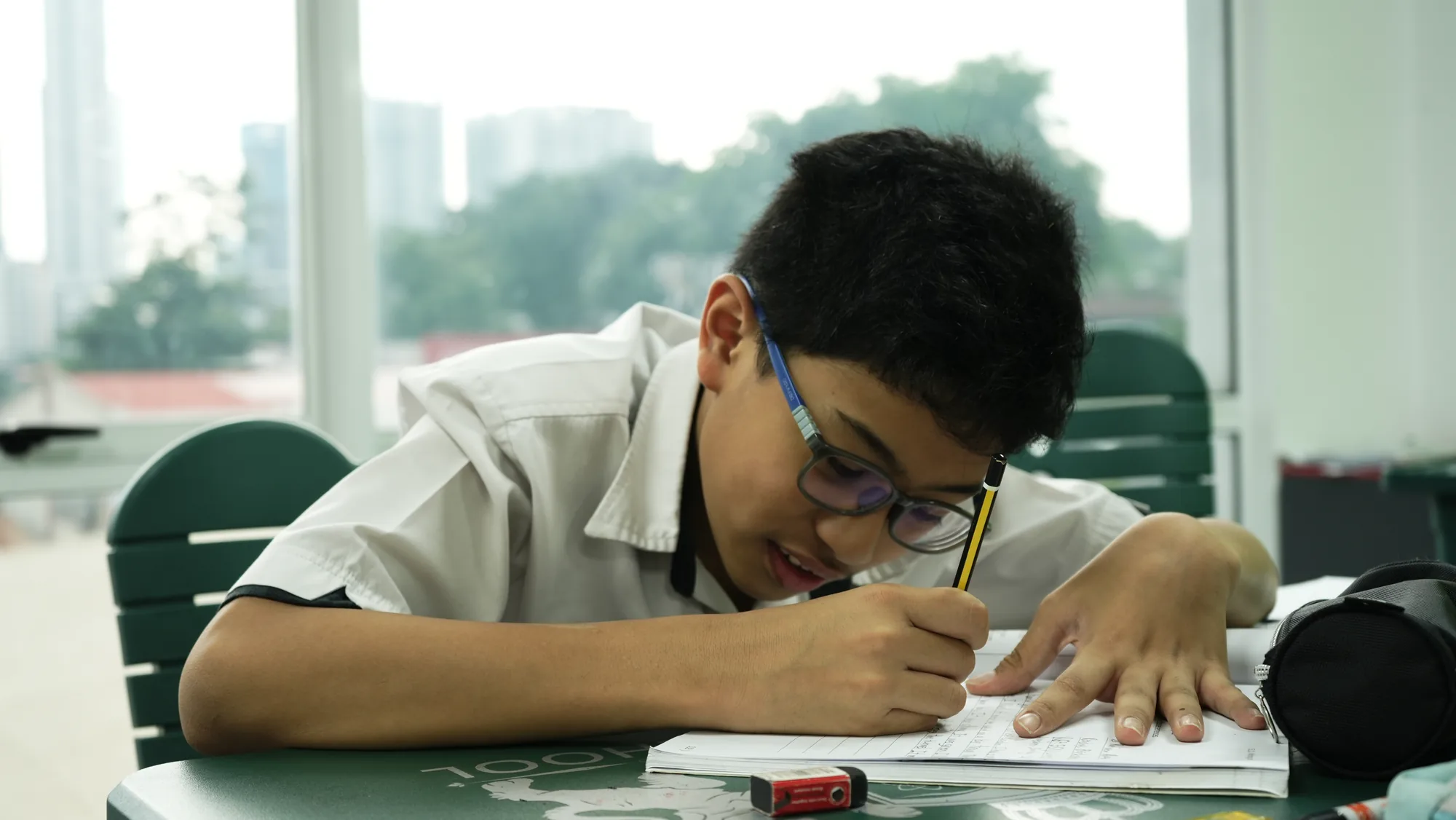 A learner working on a writing activity
